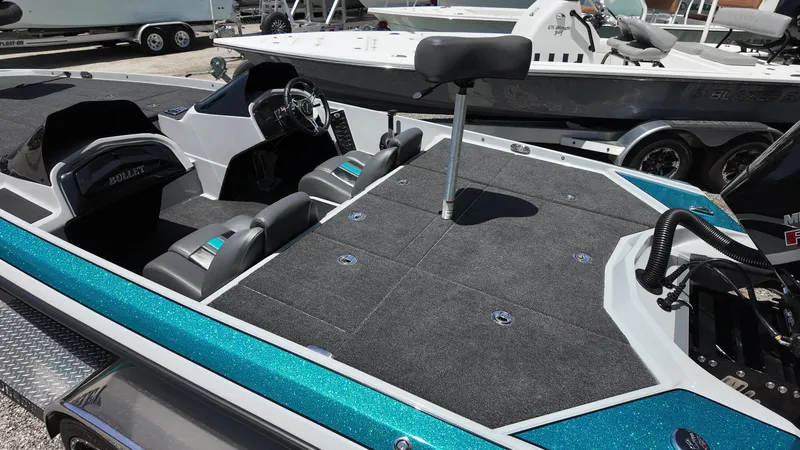 Slide: The Image of 2025 Bullet 21SDC boat interior with seating and steering wheel, featuring a sleek design. - 6