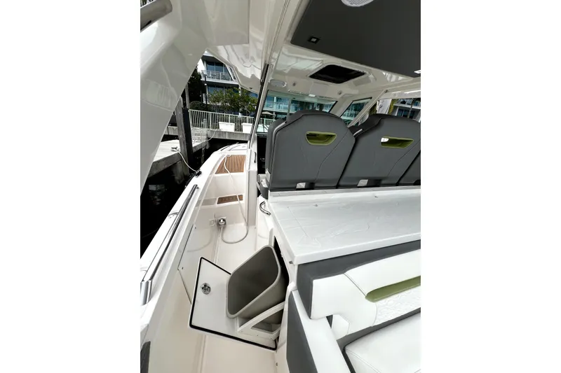 Slide: The Image of 2019 Tiara Sport 34 LS boat interior with seating and storage compartments. - 13