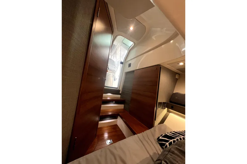 Slide: The Image of Interior of 2019 Tiara Sport 34 LS boat with wooden stairs and modern design. - 21