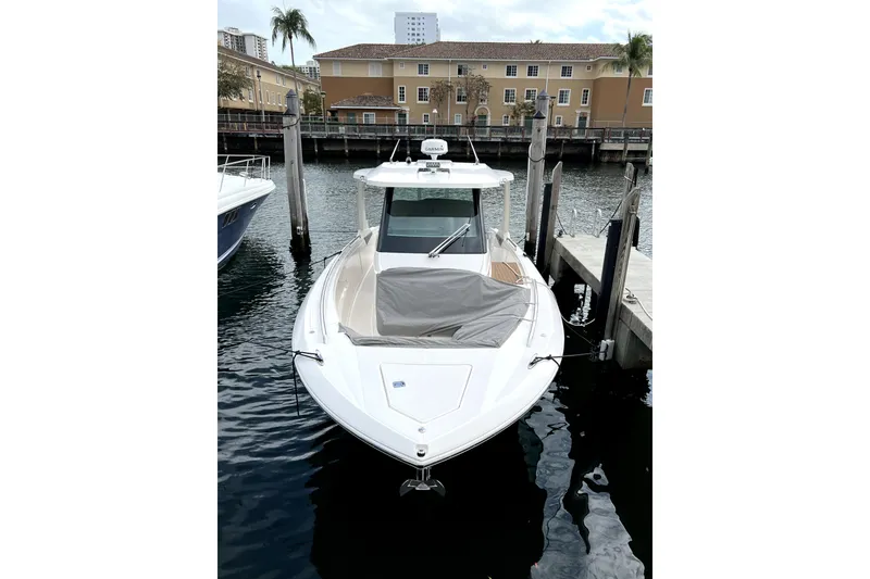 Slide: The Image of 2019 Tiara Sport 34 LS boat docked at marina, front view. - 4