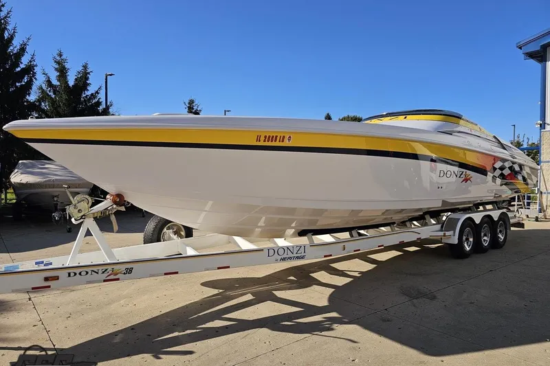 Slide: The Image of 2003 Donzi 38 ZX powerboat on trailer, featuring sleek design and vibrant graphics. - 18
