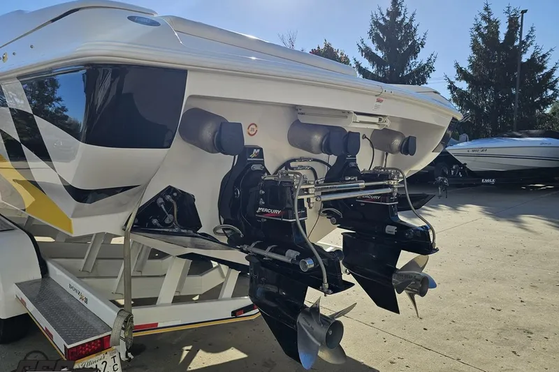 Slide: The Image of 2003 Donzi 38 ZX boat with dual Mercury outboard engines, parked on a trailer. - 26