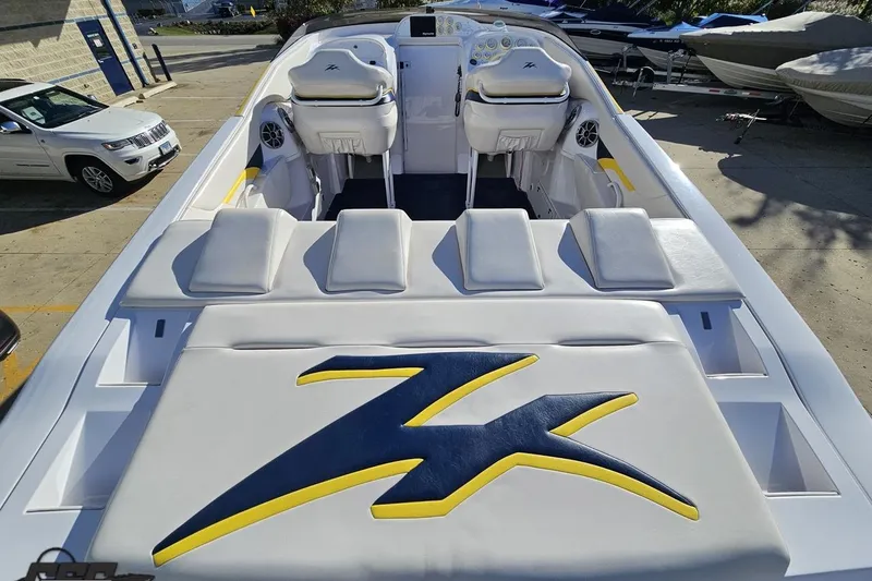 Slide: The Image of 2003 Donzi 38 ZX boat with sleek seating and distinctive logo design. - 31