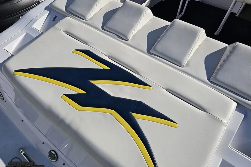 Slide: The Image of 2003 Donzi 38 ZX boat interior with stylish blue and yellow upholstery design. - 32