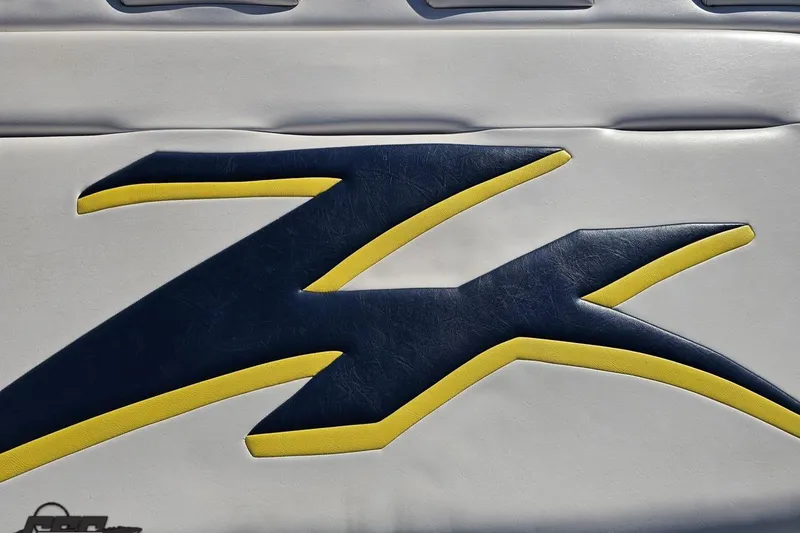 Slide: The Image of 2003 Donzi 38 ZX logo in blue and yellow on white background. - 33