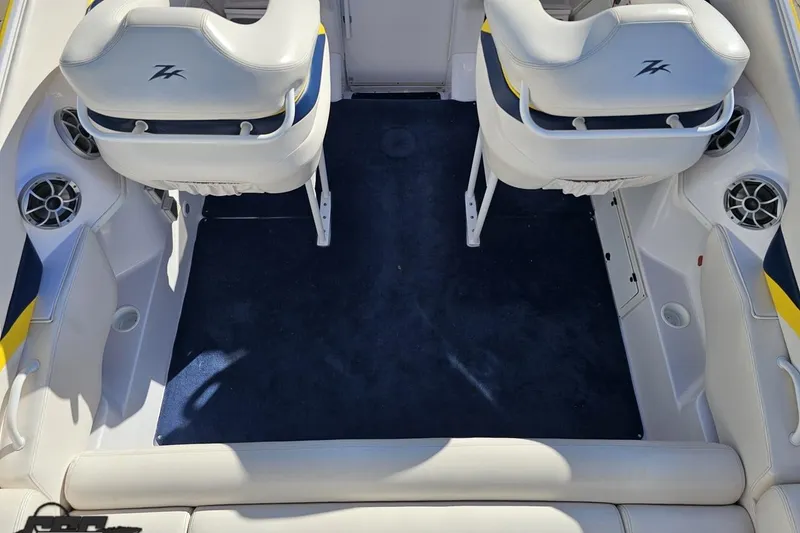 Slide: The Image of 2003 Donzi 38 ZX boat interior with white seats and blue carpet. - 37