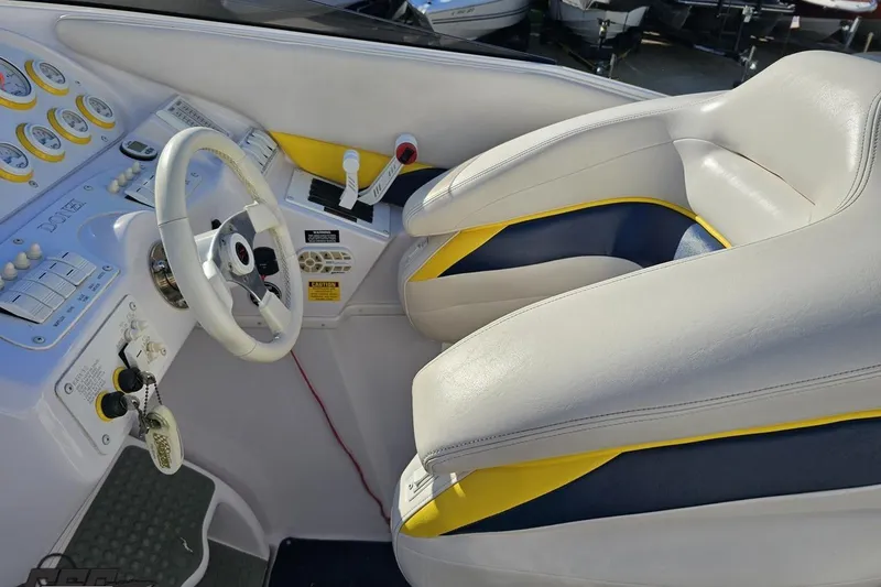 Slide: The Image of Interior of a 2003 Donzi 38 ZX boat with white and yellow seating. - 50