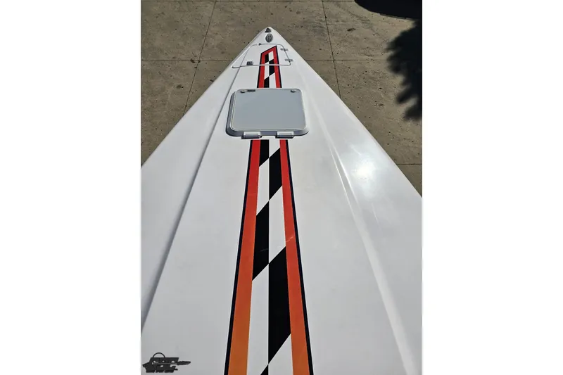 Slide: The Image of 2003 Donzi 38 ZX boat with sleek design and vibrant racing stripes. - 59