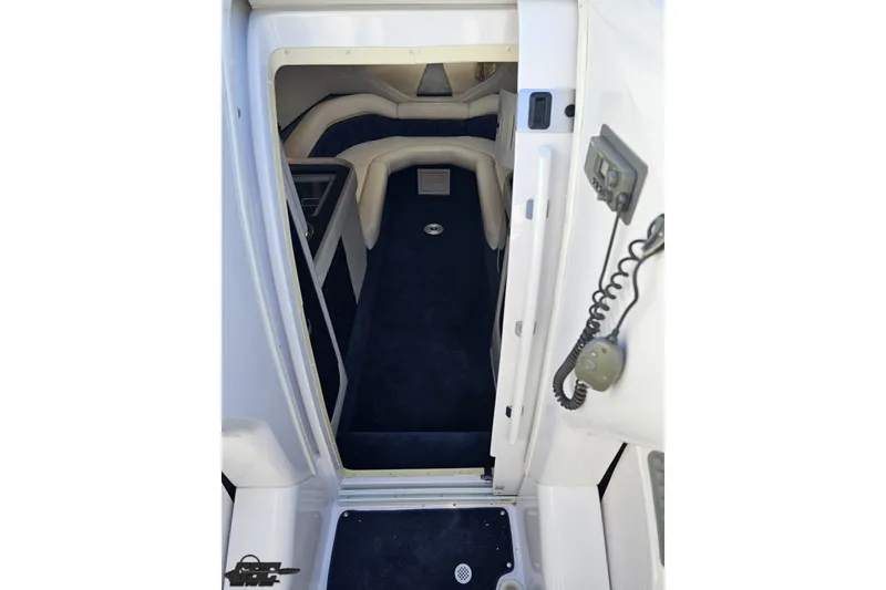 Slide: The Image of 2003 Donzi 38 ZX cabin interior with plush seating and modern amenities. - 62