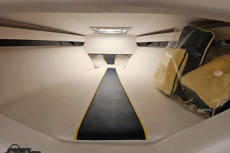Slide: The Image of Interior cabin of 2003 Donzi 38 ZX boat, featuring sleek design and yellow-accented cushions. - 80