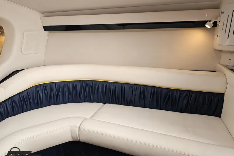 Slide: The Image of 2003 Donzi 38 ZX interior with white and blue seating, ambient lighting. - 81