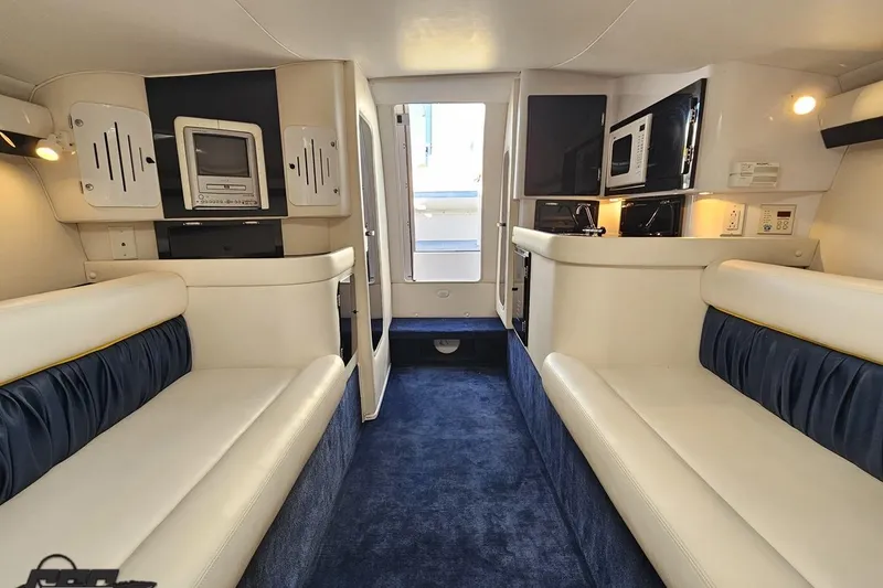 Slide: The Image of Luxurious interior of a 2003 Donzi 38 ZX boat with plush seating and modern amenities. - 82