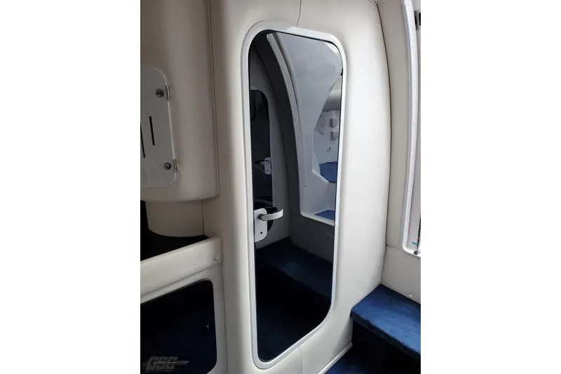 Slide: The Image of Interior of 2003 Donzi 38 ZX boat, featuring sleek white and blue design elements. - 85