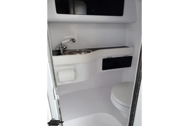 Slide: The Image of 2003 Donzi 38 ZX boat bathroom with sink and toilet. - 86