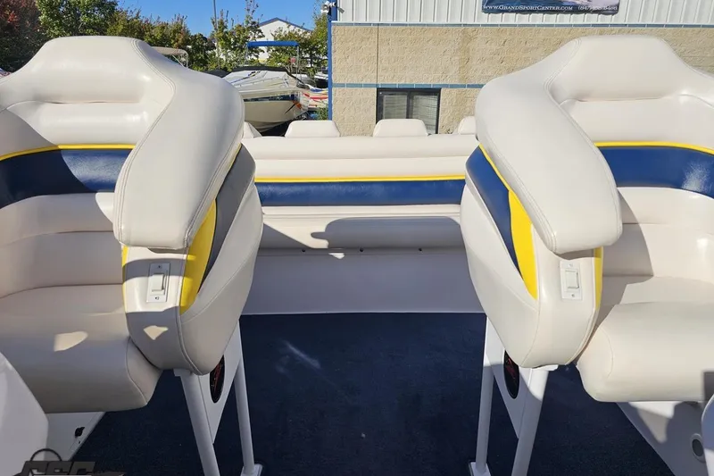 Slide: The Image of 2003 Donzi 38 ZX boat interior with white, blue, and yellow seating. - 90