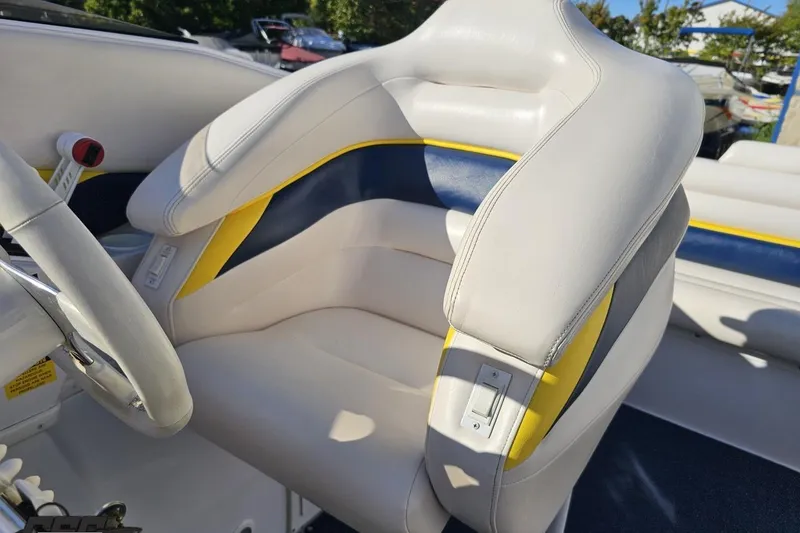 Slide: The Image of 2003 Donzi 38 ZX boat interior with white and yellow seating. - 91