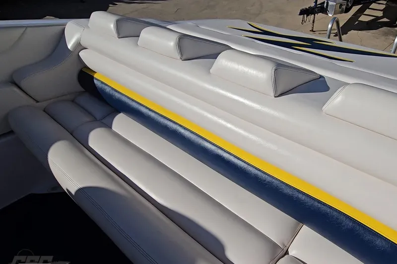 Slide: The Image of 2003 Donzi 38 ZX boat interior with white, blue, and yellow upholstery. - 93