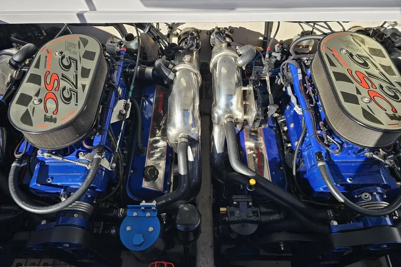 Slide: The Image of Twin engines of a 2003 Donzi 38 ZX boat, showcasing powerful mechanics. - 96