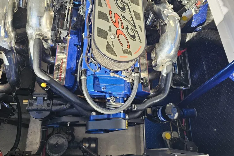 Slide: The Image of Engine of a 2003 Donzi 38 ZX boat, featuring a powerful 575 SCi motor. - 98