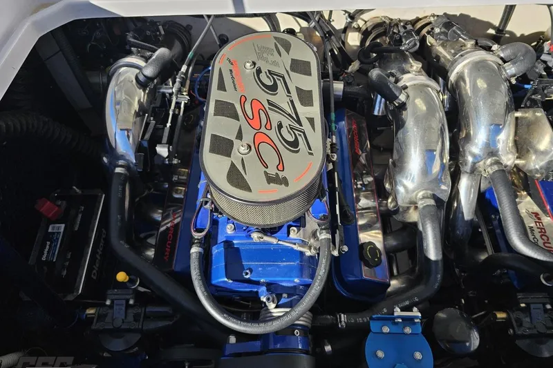 Slide: The Image of Engine of a 2003 Donzi 38 ZX boat, featuring a powerful Mercury 575 SCi. - 99