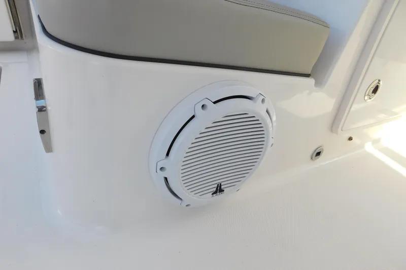 Slide: The Image of 2024 Pursuit DC 326 Dual Console boat interior with JL Audio speaker. - 26