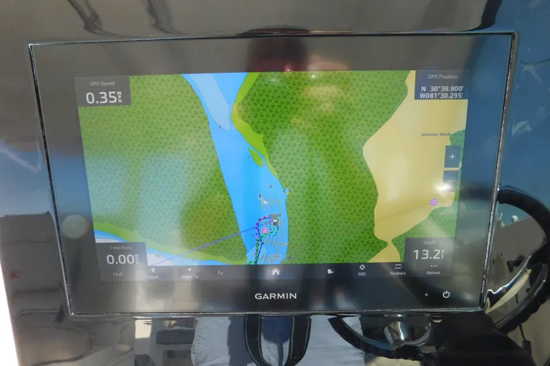 Slide: The Image of Garmin navigation display on 2024 Pursuit DC 326 Dual Console boat, showing map and GPS data. - 40