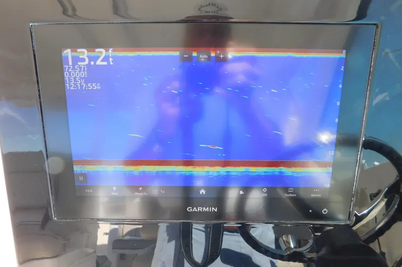 Slide: The Image of Garmin display on 2024 Pursuit DC 326 Dual Console showing sonar data. - 41