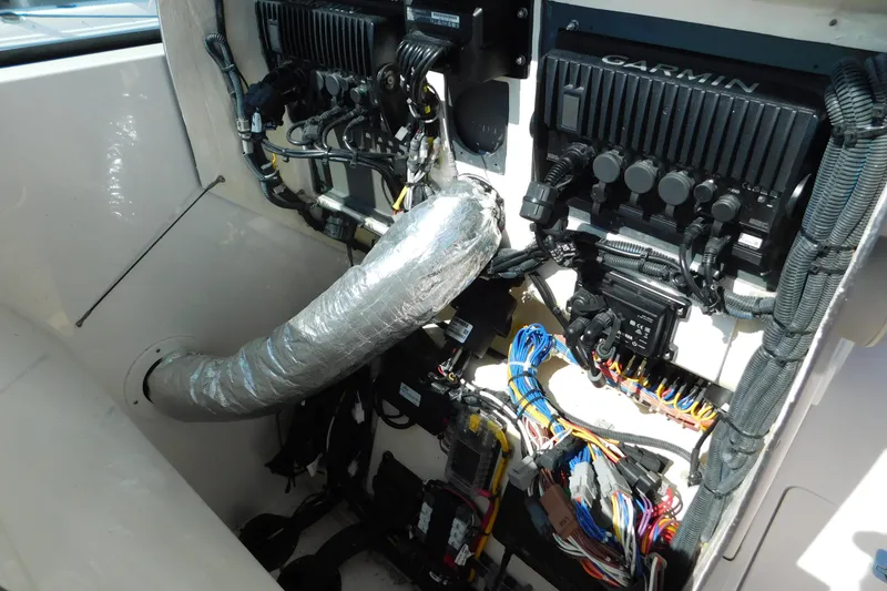 Slide: The Image of 2024 Pursuit DC 326 Dual Console boat electronics and wiring setup with Garmin equipment. - 43
