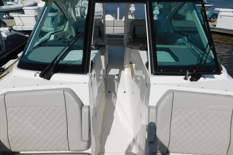 Slide: The Image of 2024 Pursuit DC 326 Dual Console boat with sleek design and comfortable seating. - 52