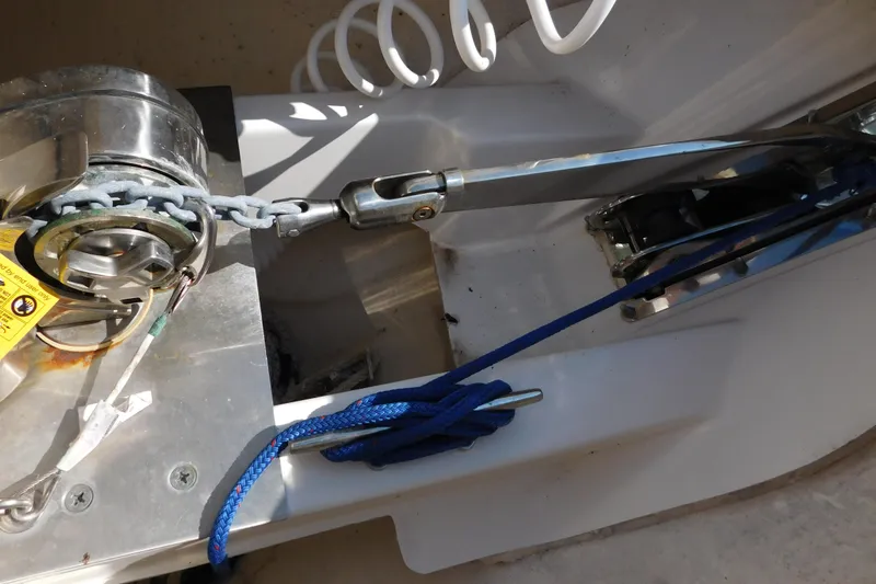 Slide: The Image of 2024 Pursuit DC 326 Dual Console anchor system with chain and blue rope. - 54