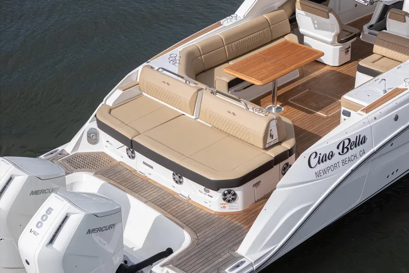 Slide: The Image of 2023 Sea Ray SLX 400 Outboard luxury boat with spacious seating and twin Mercury engines. - 12