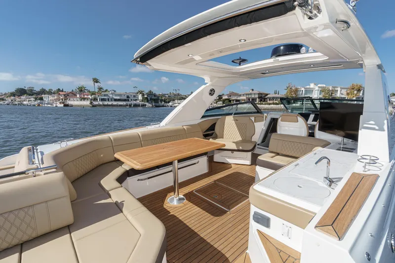 Slide: The Image of Luxurious 2023 Sea Ray SLX 400 Outboard boat interior with elegant seating and modern amenities. - 13