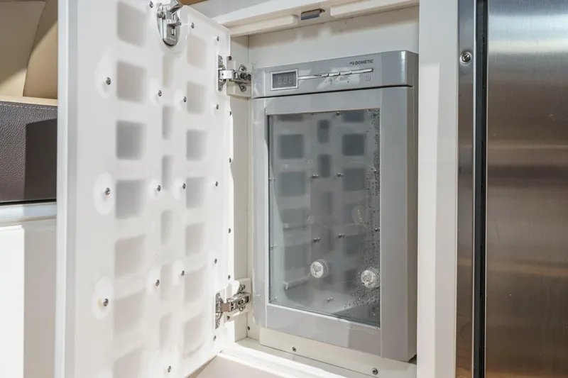 Slide: The Image of Built-in ice maker on 2023 Sea Ray SLX 400 Outboard boat. - 18