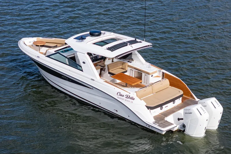 Slide: The Image of 2023 Sea Ray SLX 400 Outboard luxury boat cruising on open water. - 3