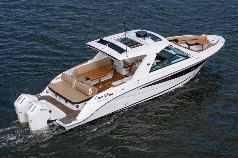 Slide: The Image of 2023 Sea Ray SLX 400 Outboard cruising on water, featuring luxurious seating and sleek design. - 36