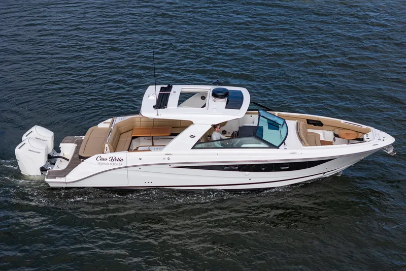Slide: The Image of 2023 Sea Ray SLX 400 Outboard cruising on water, featuring luxurious seating and sleek design. - 37