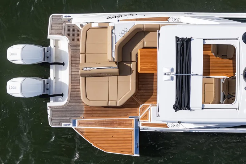 Slide: The Image of 2023 Sea Ray SLX 400 Outboard, aerial view, luxurious deck and seating, dual engines. - 6