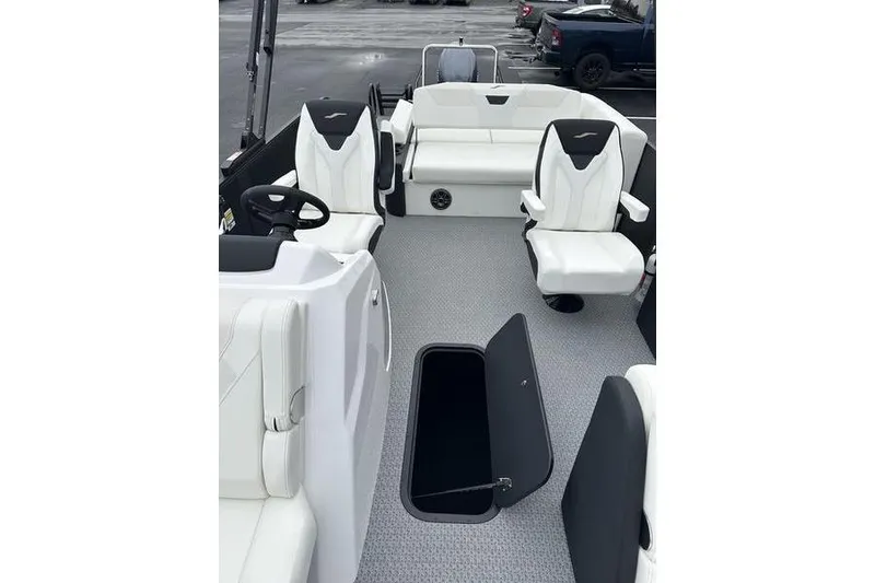Slide: The Image of Luxurious interior of 2026 Evotti 523CS boat with white seating and open storage compartment. - 11