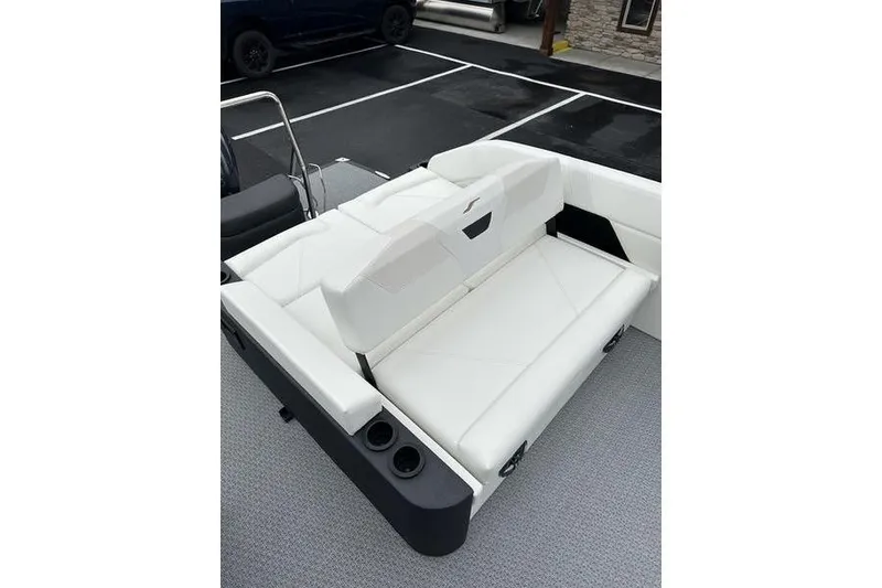 Slide: The Image of Evotti 523CS 2026 boat interior with white seating and cup holders. - 12