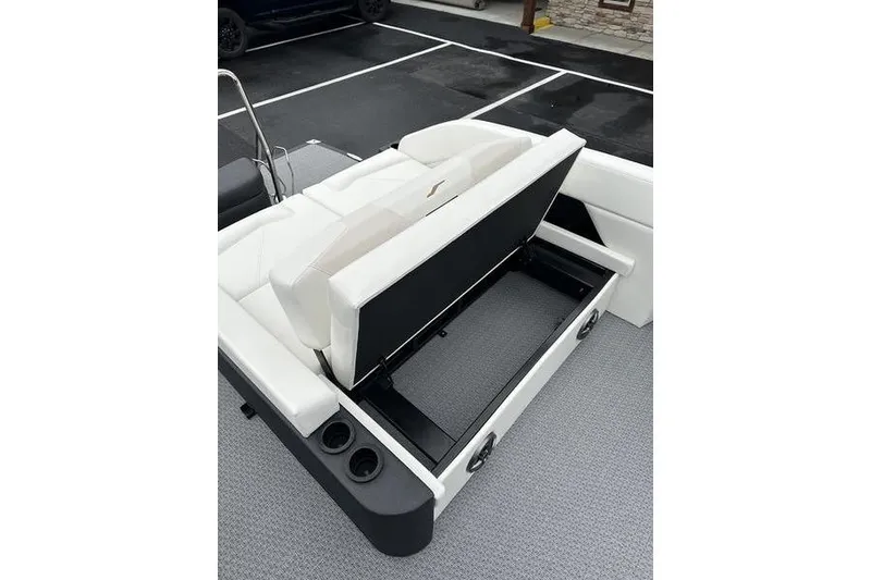 Slide: The Image of 2026 Evotti 523CS boat with open storage compartment and white seating. - 14
