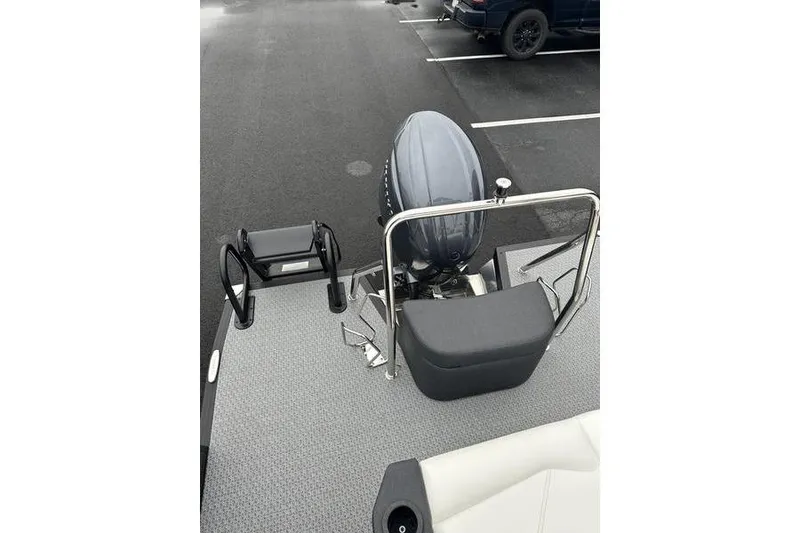 Slide: The Image of 2026 Evotti 523CS boat with outboard motor and seating, parked in a lot. - 19