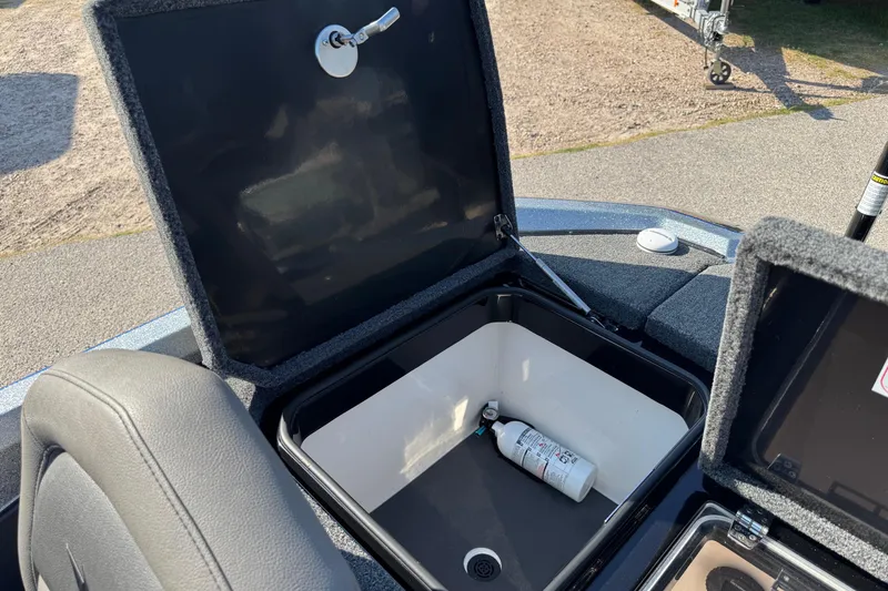Slide: The Image of Open storage compartment in 2023 Vexus VX20 boat with fire extinguisher inside. - 13