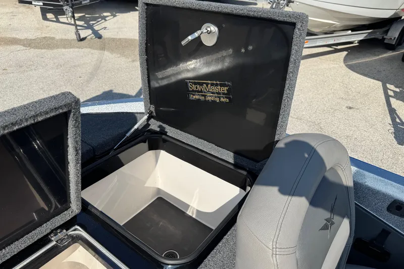 Slide: The Image of 2023 Vexus VX20 boat storage compartment with StowMaster landing nets. - 14