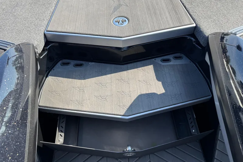 Slide: The Image of 2023 Vexus VX20 boat deck with storage compartment and sleek design. - 17