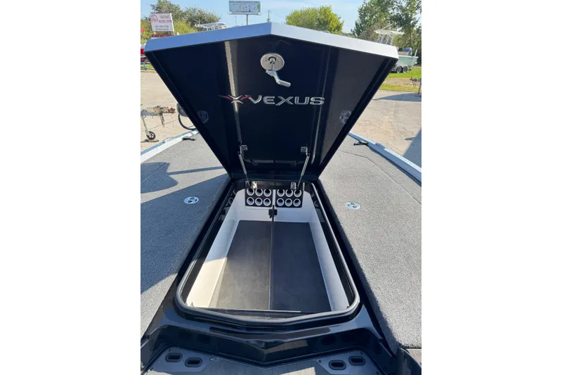 Slide: The Image of 2023 Vexus VX20 boat storage compartment open, showcasing interior rod holders. - 18