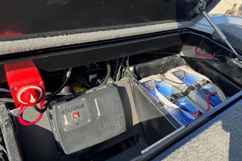 Slide: The Image of 2023 Vexus VX20 battery compartment with charger and power switch. - 24