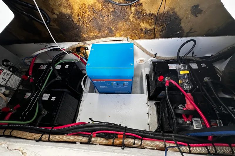Slide: The Image of Electrical system in a 2008 Sailfish 3006 boat, featuring batteries and wiring. - 23