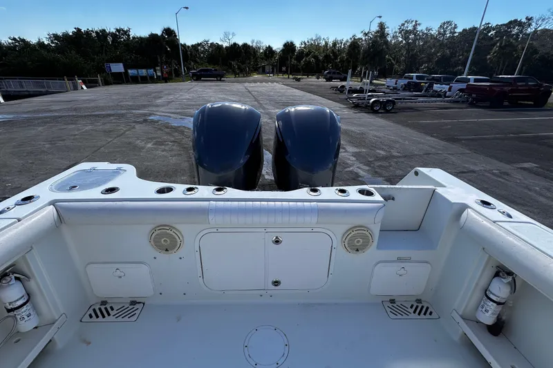 Slide: The Image of 2008 Sailfish 3006 boat with dual engines at a parking lot. - 6