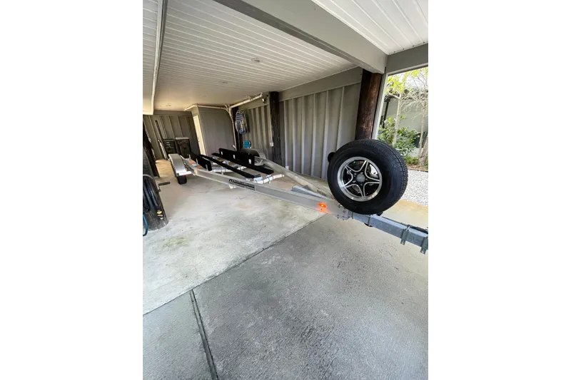 Slide: The Image of 2022 Boston Whaler 220 Dauntless boat interior with open storage compartment. - 25