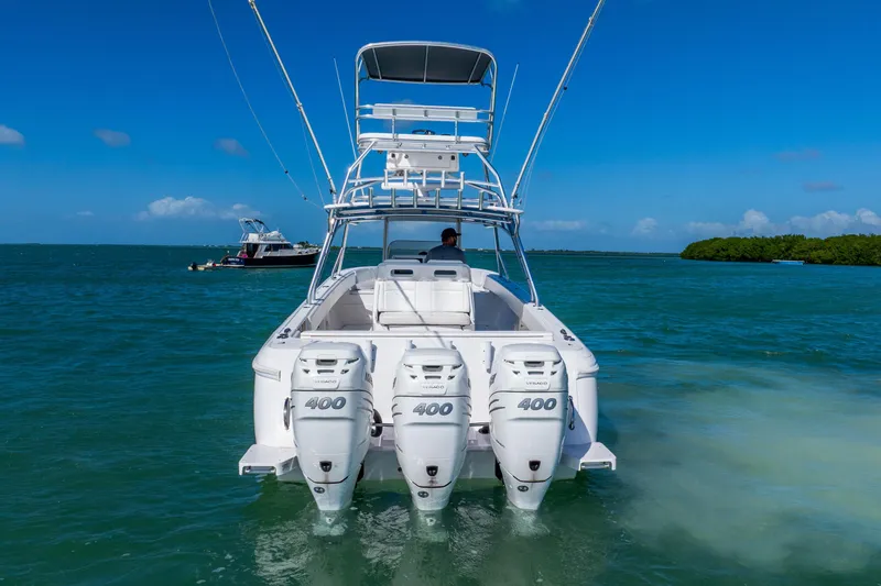 Slide: The Image of 2016 Intrepid 400 Center Console boat on clear blue water. - 14